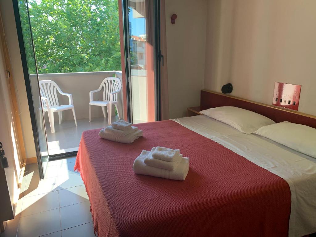 Postel nebo postele na pokoji v ubytování Hotel Giglio