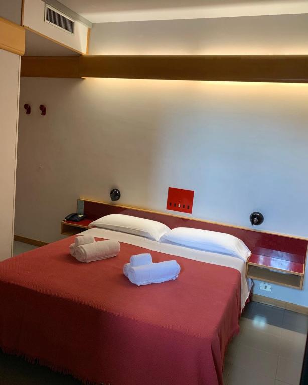 Postel nebo postele na pokoji v ubytování Hotel Giglio