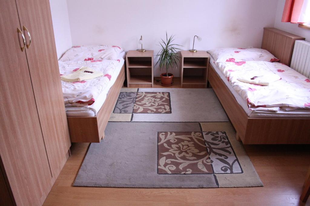Posteľ alebo postele v izbe v ubytovaní Penzión Koras