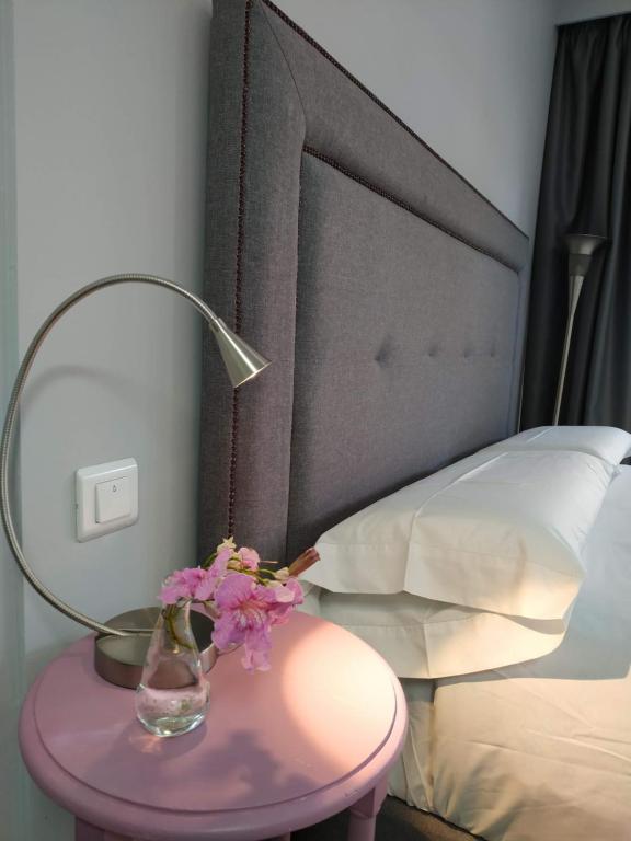 Posteľ alebo postele v izbe v ubytovaní Kentia Rooms