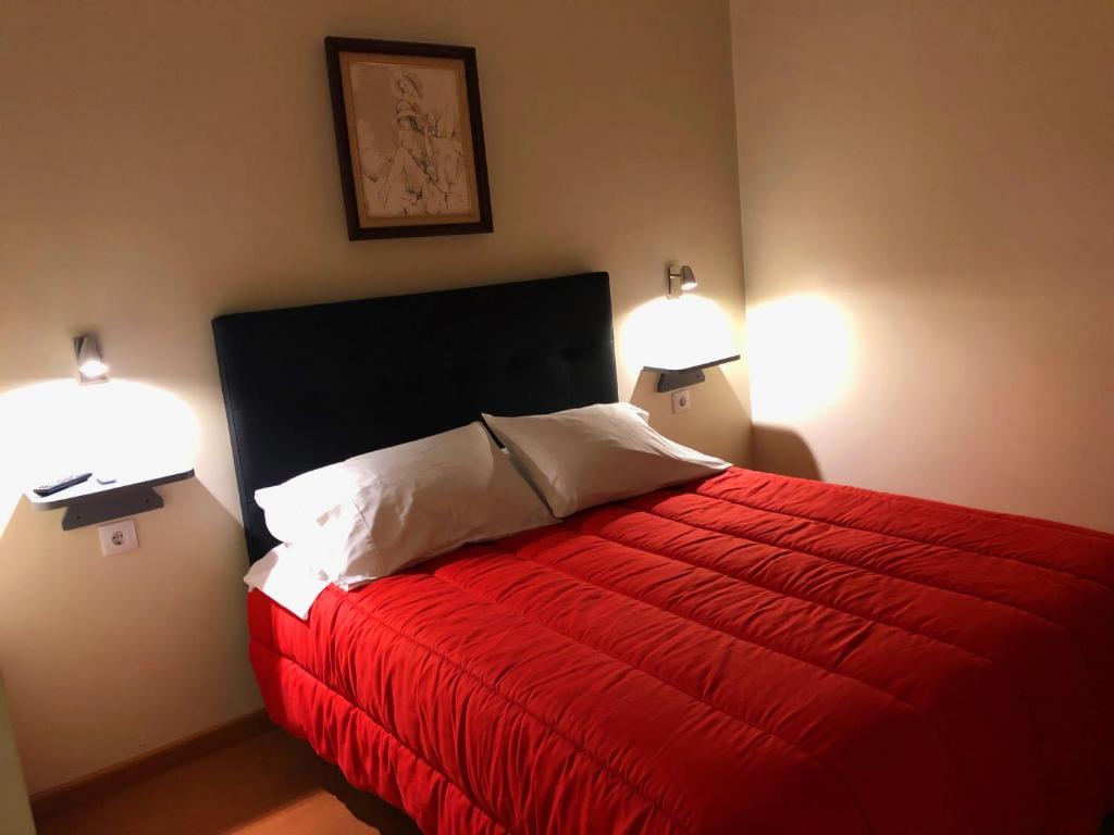Postel nebo postele na pokoji v ubytování Abrigo do Portinho