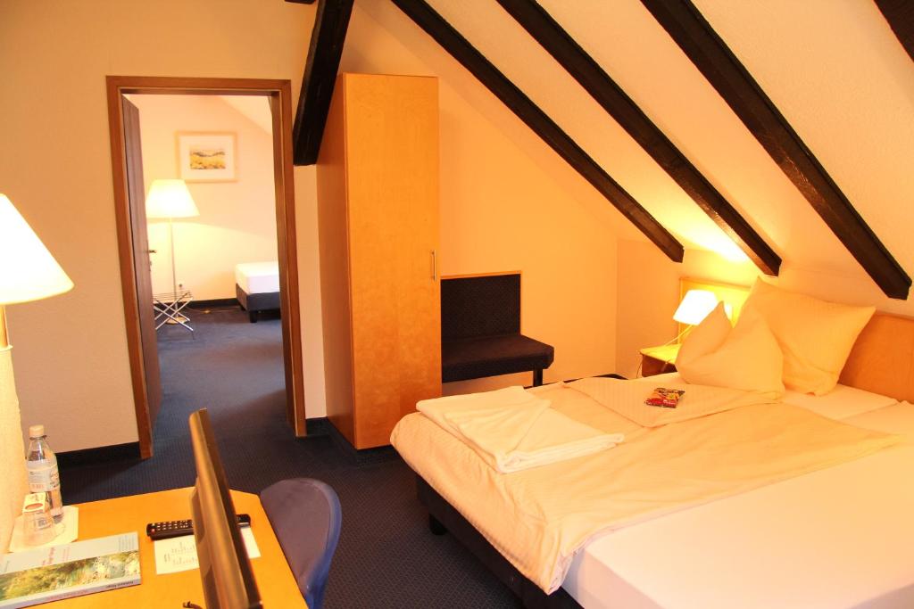 Postel nebo postele na pokoji v ubytování Hotel Klinger