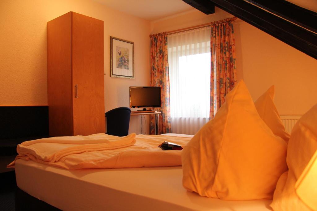 Postel nebo postele na pokoji v ubytování Hotel Klinger