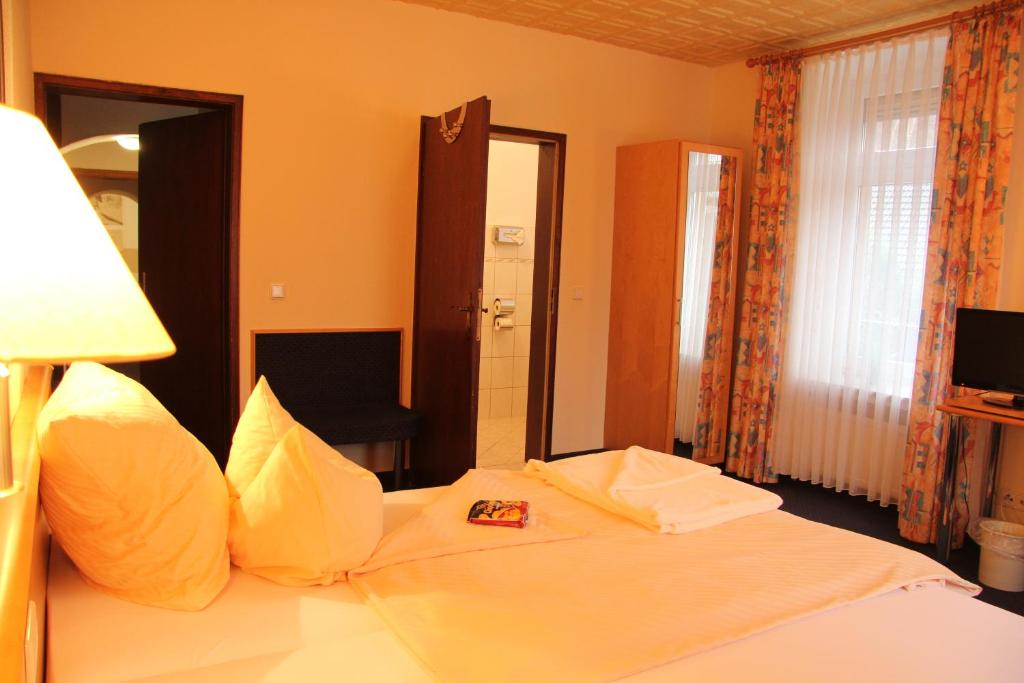 Postel nebo postele na pokoji v ubytování Hotel Klinger