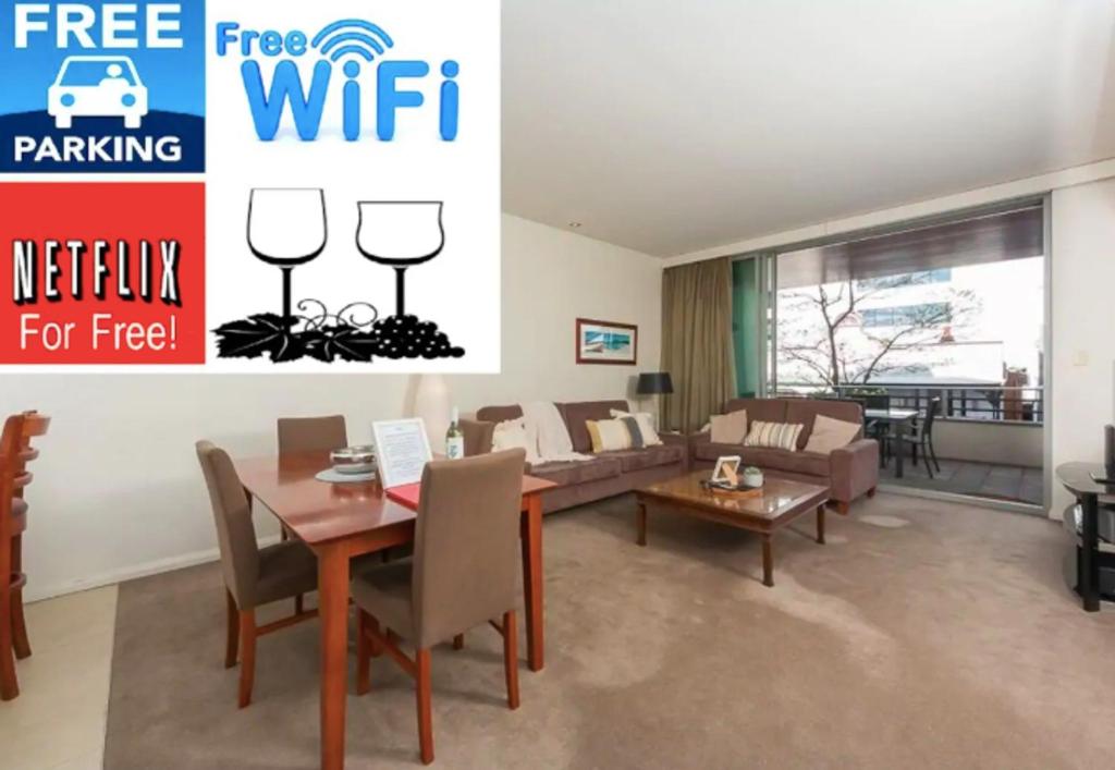 a living room with a dining table and a couch at TRANQUIL EXEC CITY FREE WIFI NETFLIX WINE PARKING in Perth