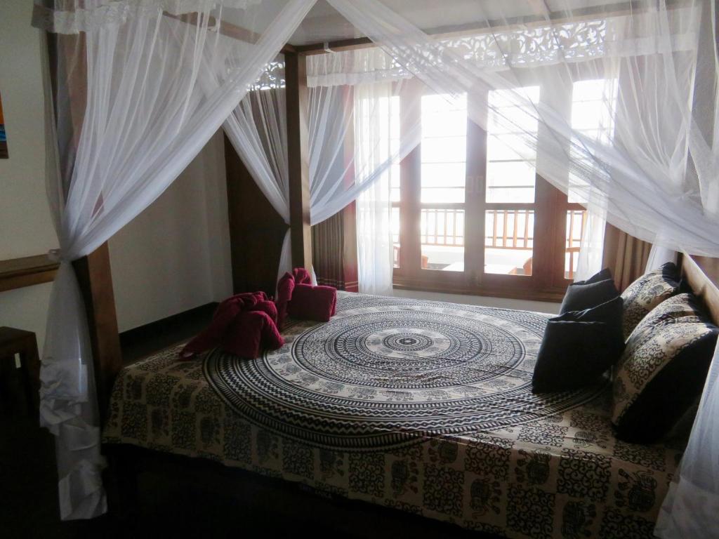 Postel nebo postele na pokoji v ubytování Thoduwawa Beach Villa