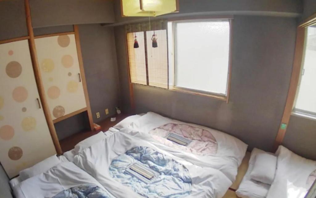 Giường trong phòng chung tại Setouchi Triennale Hotel 303 Japanese style Art Female only - Vacation STAY 62189