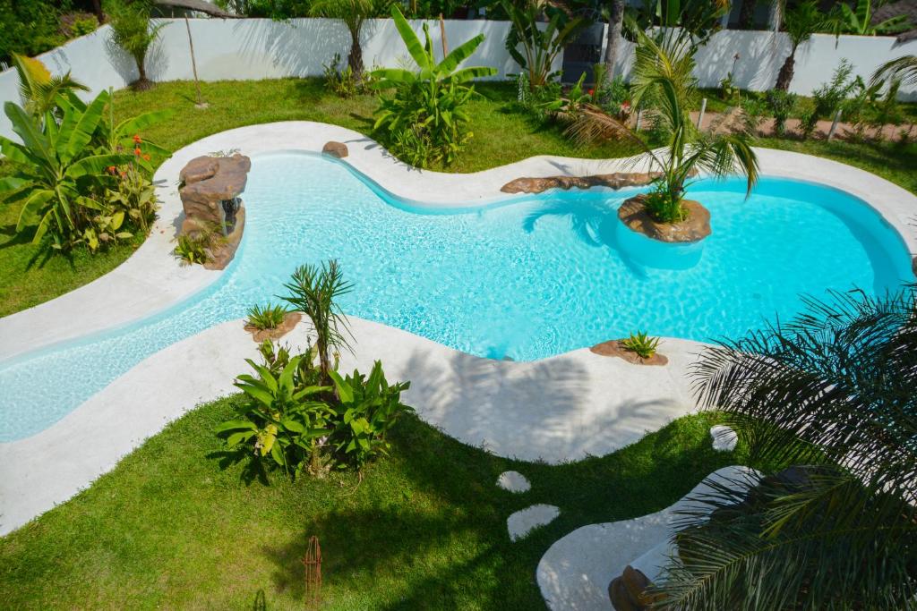 an overhead view of a swimming pool in a yard at Oasis club in Cap Skirring