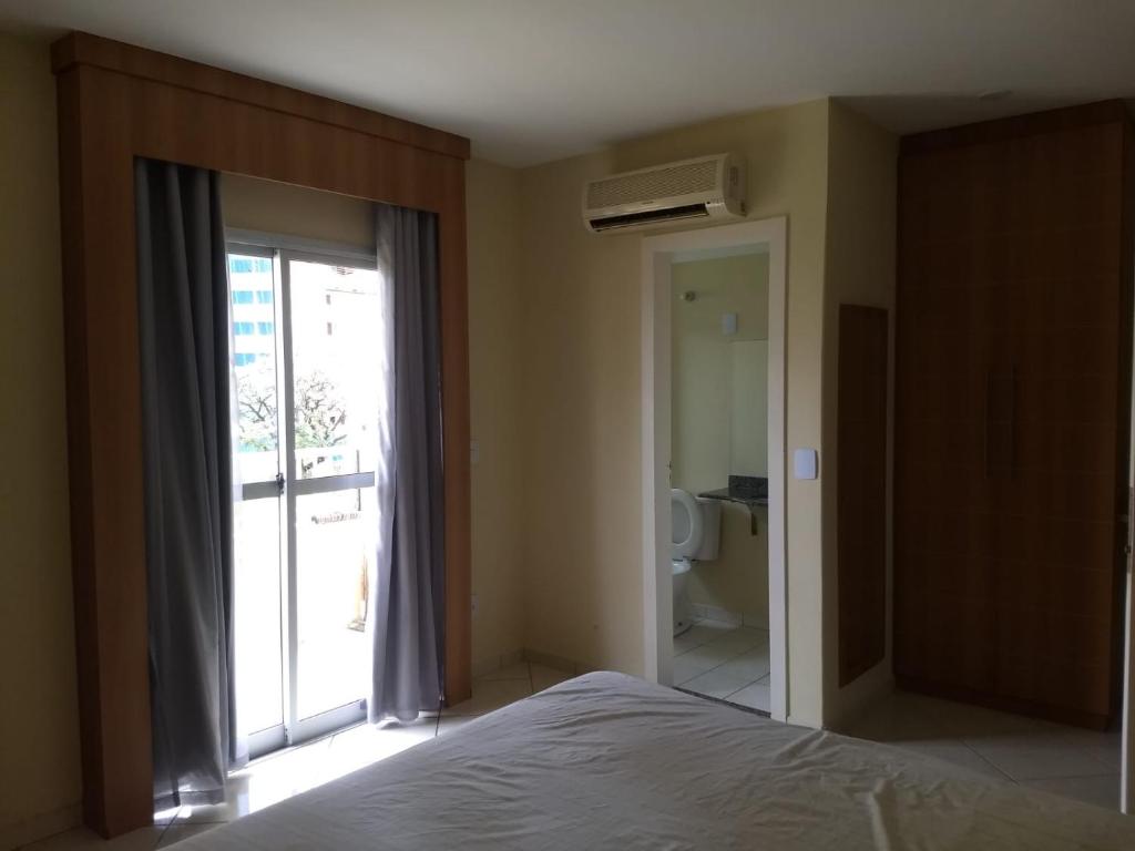 Ένα ή περισσότερα κρεβάτια σε δωμάτιο στο APARTAMENTO FLAT CONDOMÍNIO THERMAS PLACE