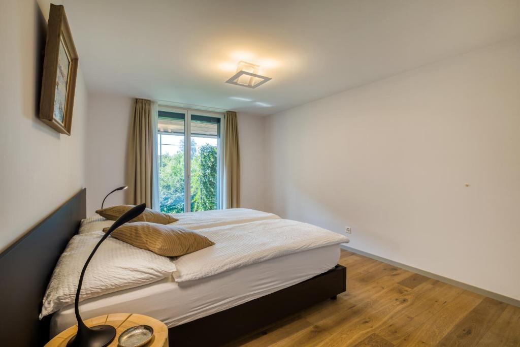 Voodi või voodid majutusasutuse Hôtel la Croix Blanche toas