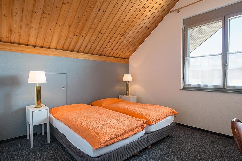 Voodi või voodid majutusasutuse Hôtel la Croix Blanche toas