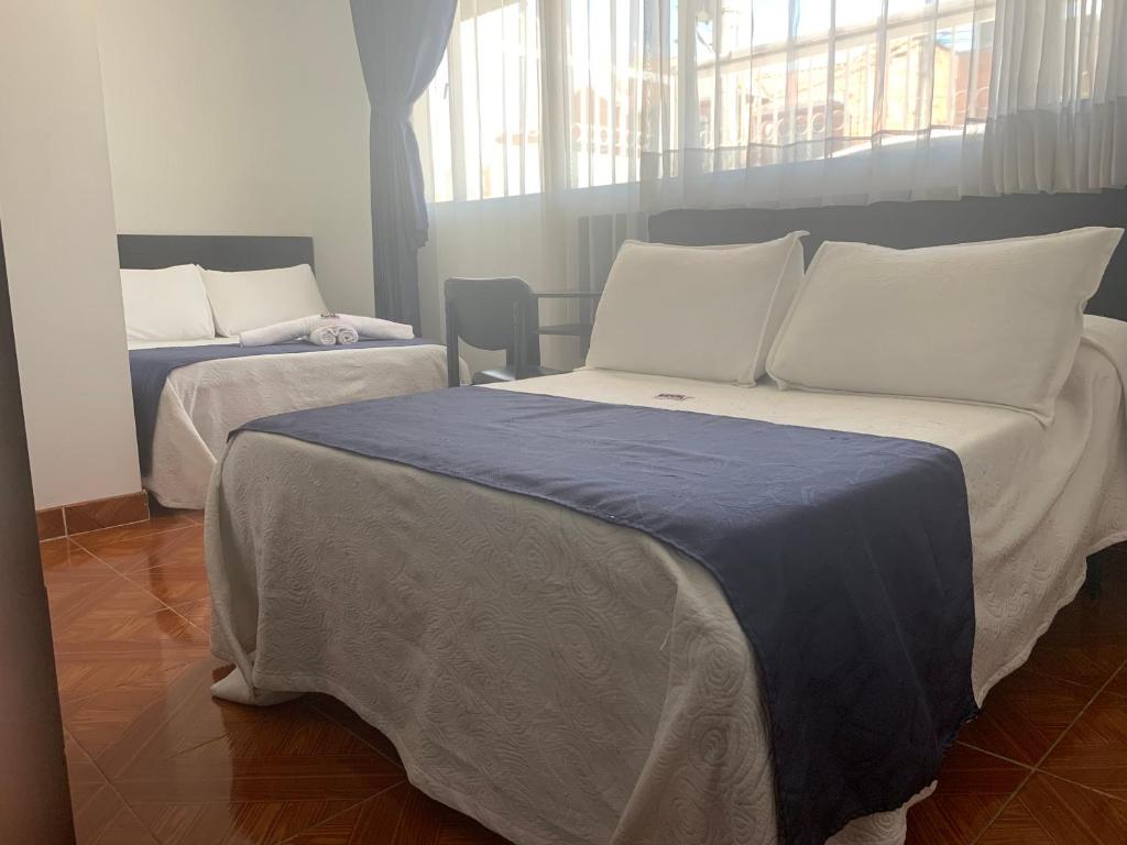 Postel nebo postele na pokoji v ubytování Hotel Casa Guillermo