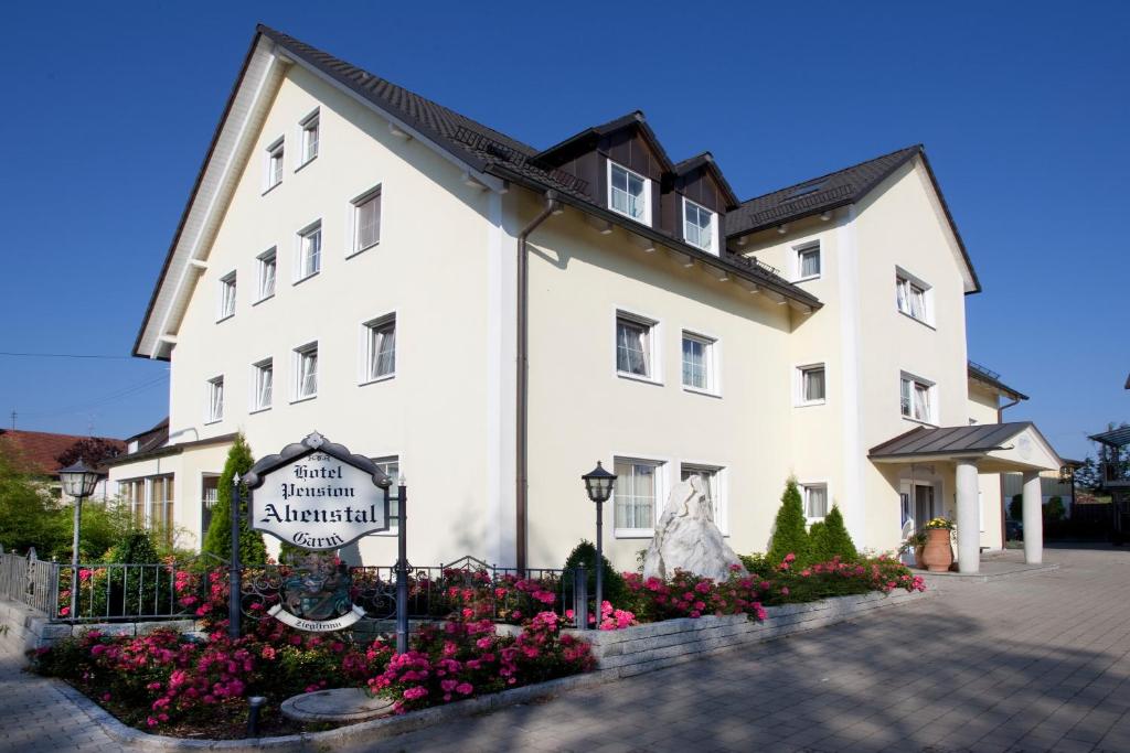 a large white building with a sign in front of it at Hotel Abenstal in Au in der Hallertau