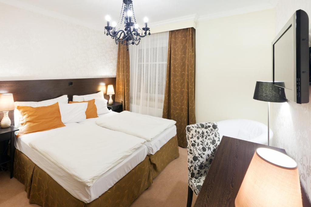 Posteľ alebo postele v izbe v ubytovaní Pytloun Design Self Check-in Hotel