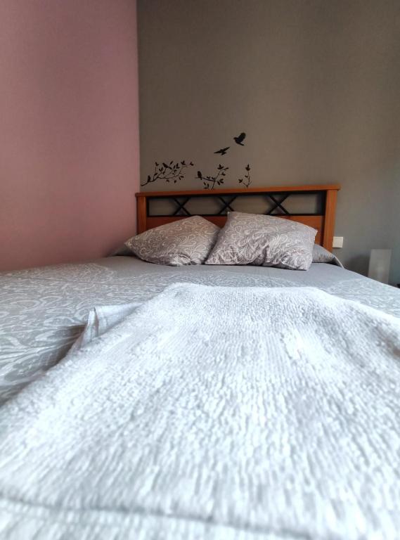 Postel nebo postele na pokoji v ubytování Hostal El Bodegon