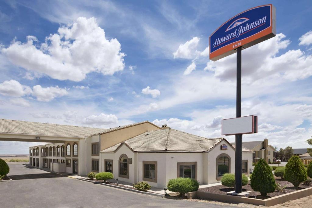 a sign in front of a mobil oil building at Howard Johnson by Wyndham Holbrook in Holbrook