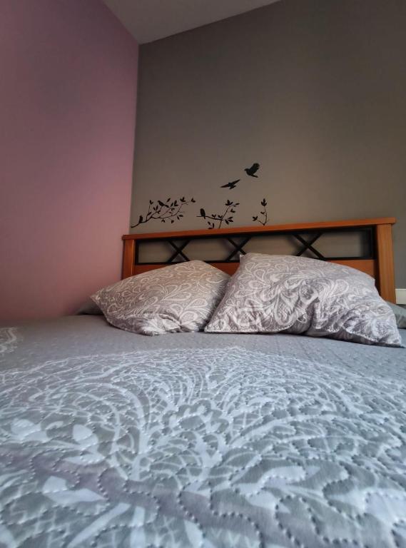Postel nebo postele na pokoji v ubytování Hostal El Bodegon