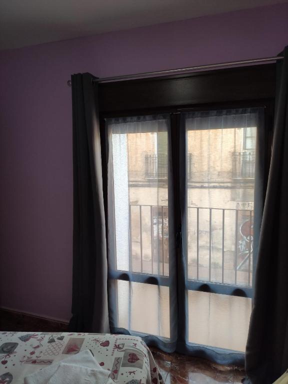 Postel nebo postele na pokoji v ubytování Hostal El Bodegon