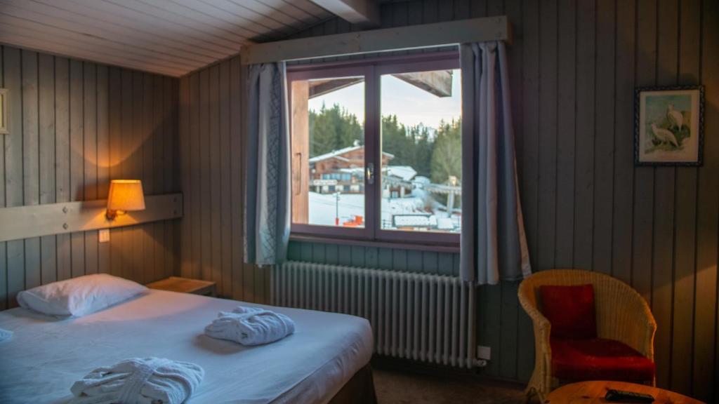 Postel nebo postele na pokoji v ubytování Hôtel Arbois Bettex