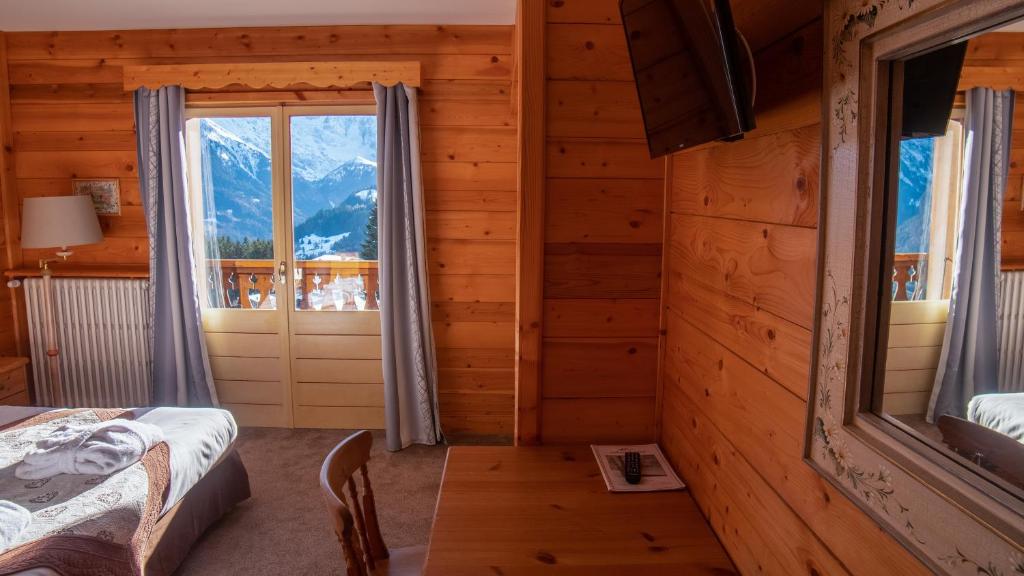 Postel nebo postele na pokoji v ubytování Hôtel Arbois Bettex