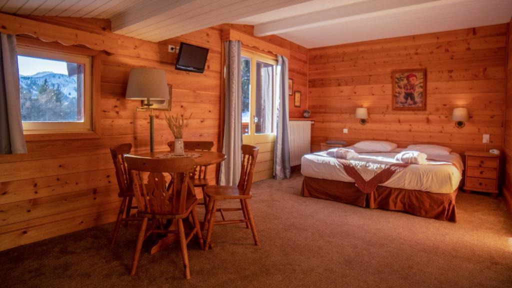 Postel nebo postele na pokoji v ubytování Hôtel Arbois Bettex
