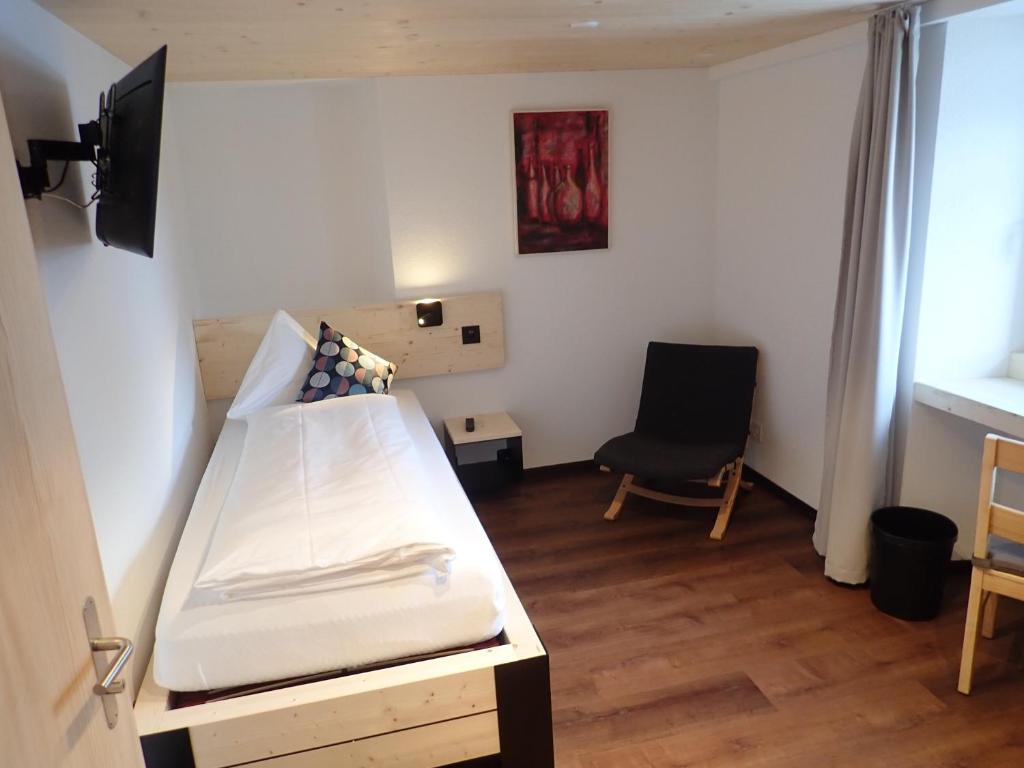 Postel nebo postele na pokoji v ubytování Hotel Furka
