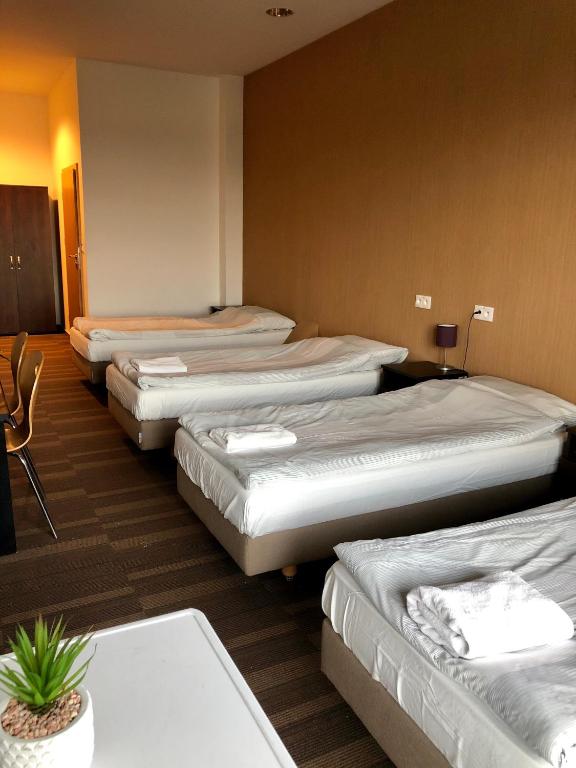 Postel nebo postele na pokoji v ubytování Hipodrom Sopot