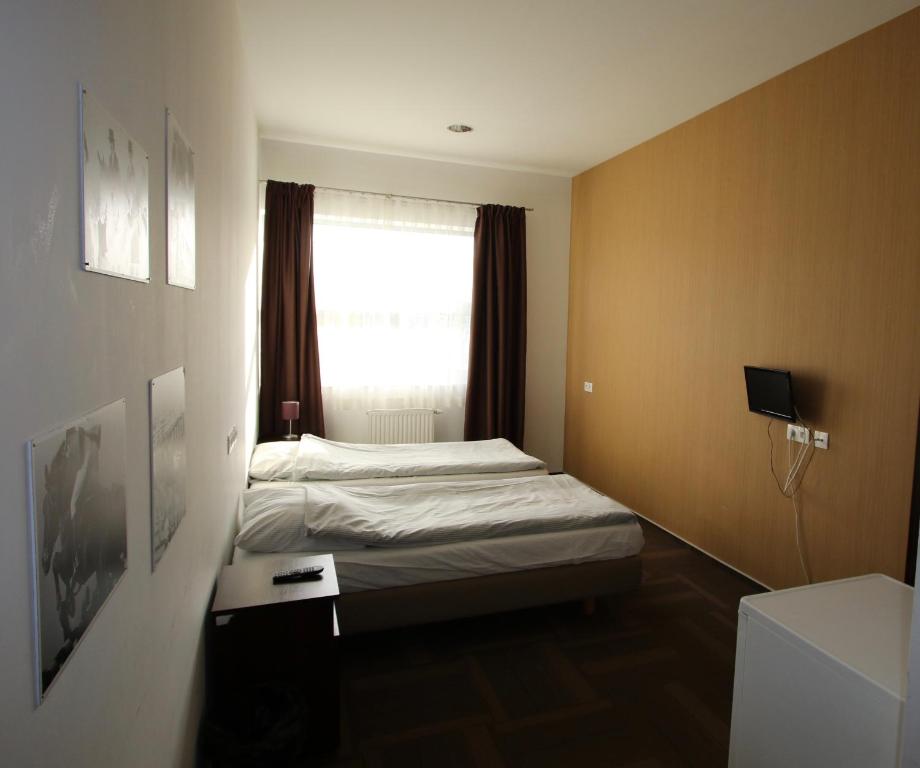 Postel nebo postele na pokoji v ubytování Hipodrom Sopot