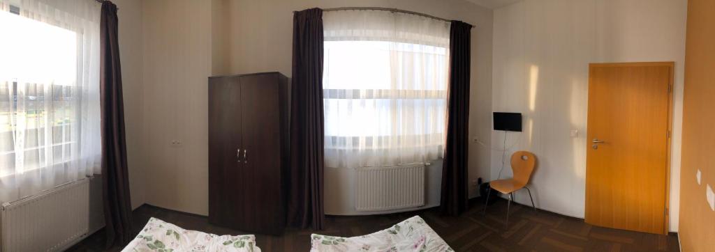 Postel nebo postele na pokoji v ubytování Hipodrom Sopot