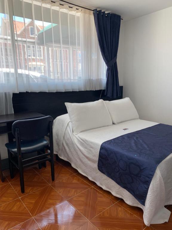 Postel nebo postele na pokoji v ubytování Hotel Casa Guillermo