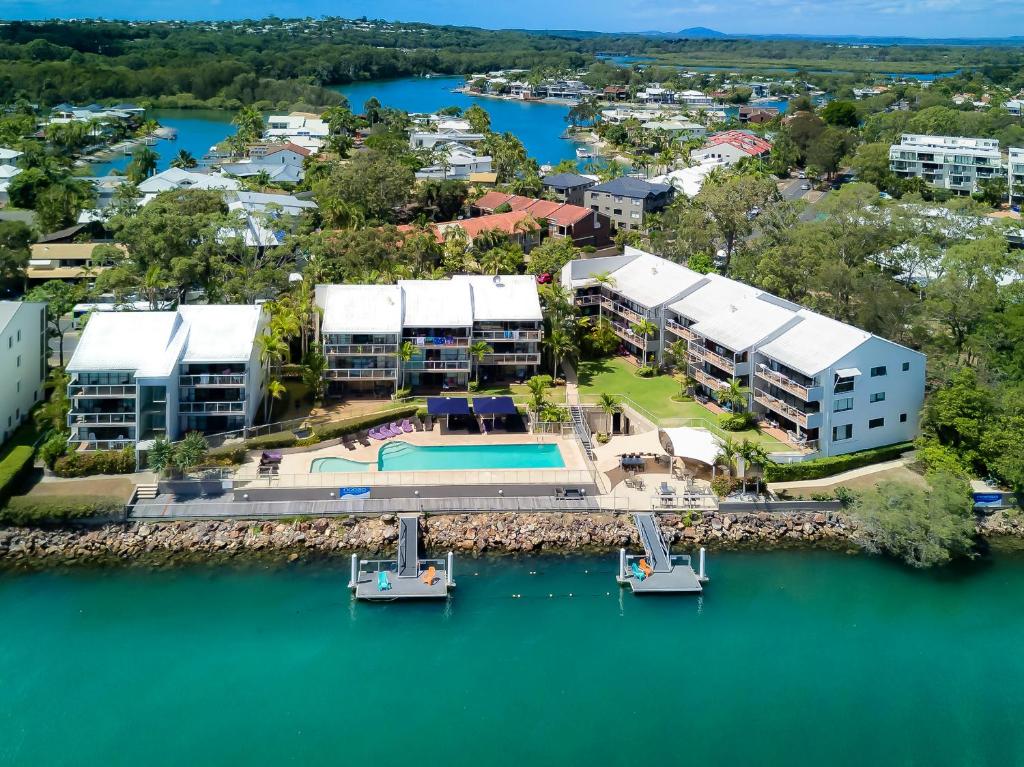 an aerial view of a resort with a body of water at Noosa Shores Resort in Noosa Heads