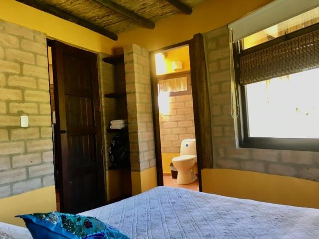 Postel nebo postele na pokoji v ubytování Cabaña Campestre Sol Muisca RNT85322
