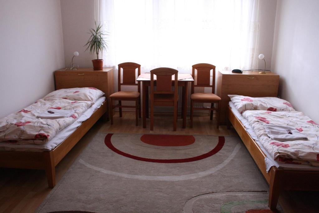 Posteľ alebo postele v izbe v ubytovaní Penzión Koras