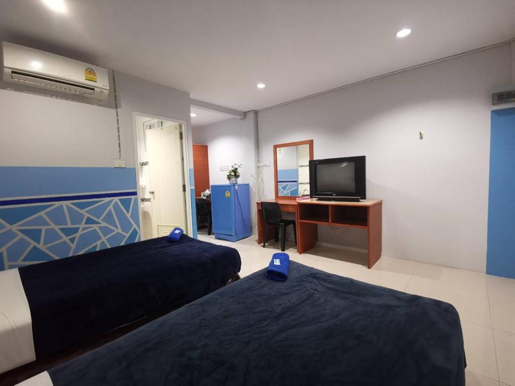 Postel nebo postele na pokoji v ubytování Ban Kaew Guesthouse Songkhla