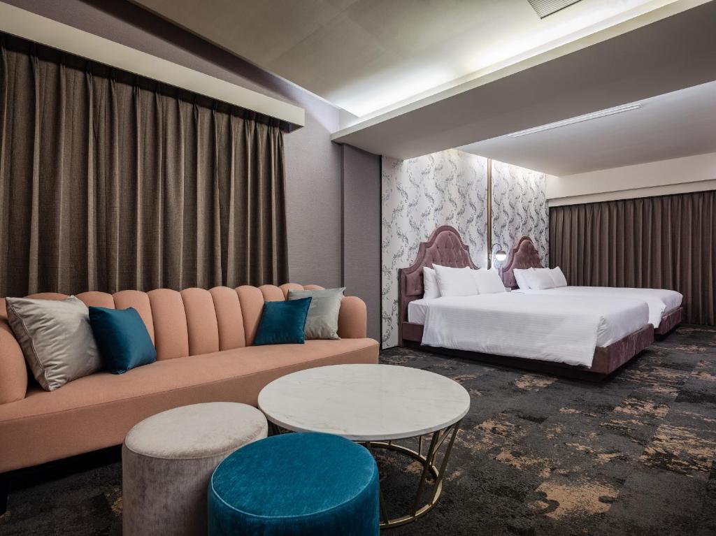 Postel nebo postele na pokoji v ubytování Kung Shang Design Hotel
