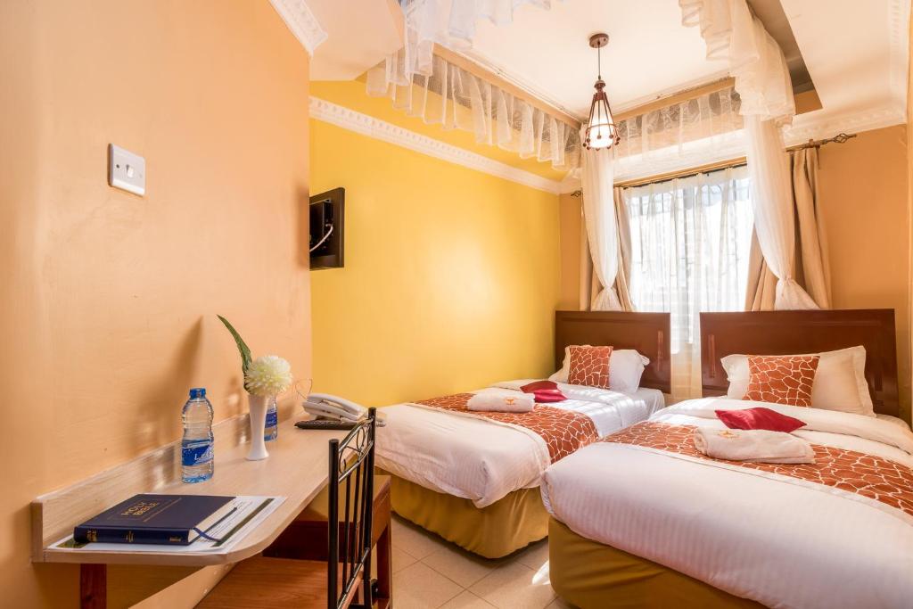 Postel nebo postele na pokoji v ubytování Javilla Eagles Safari Guest house