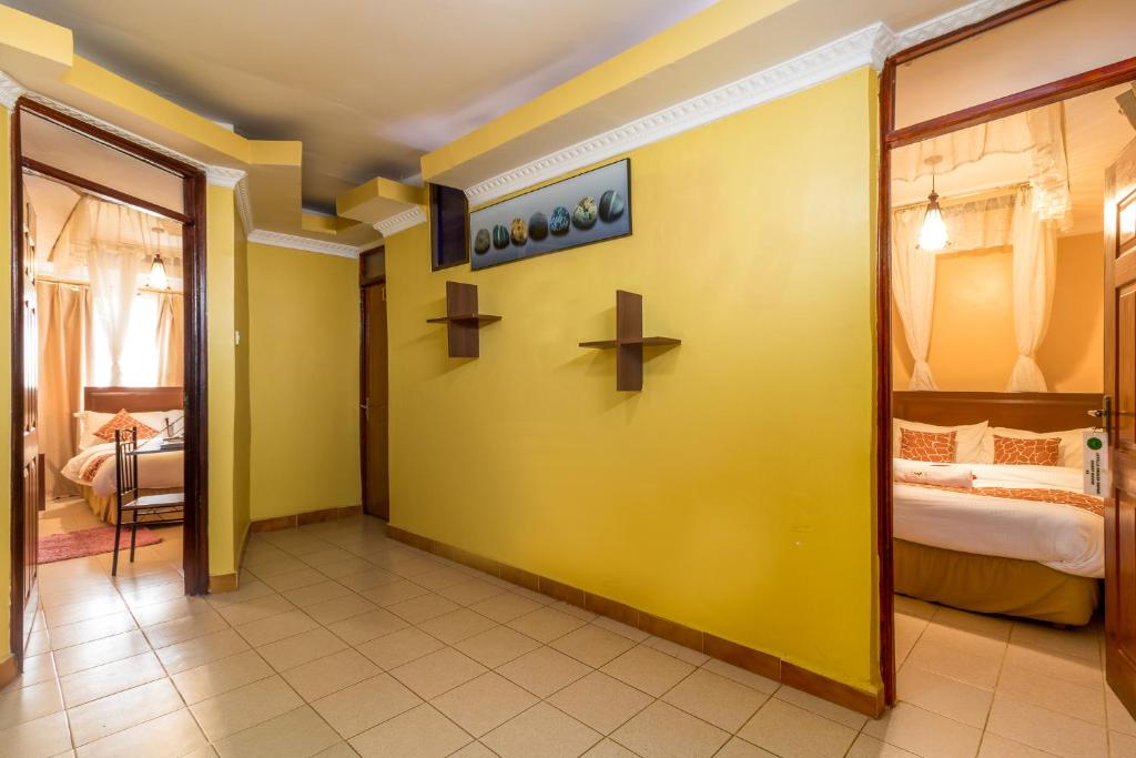 Postel nebo postele na pokoji v ubytování Javilla Eagles Safari Guest house