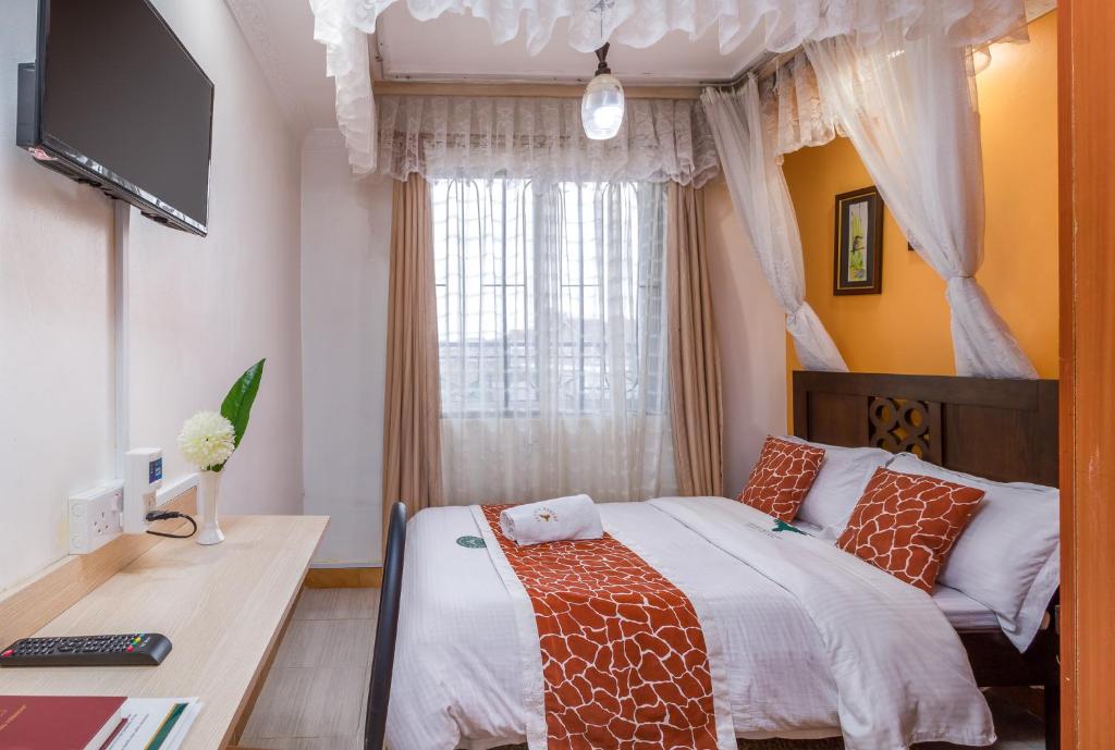 Postel nebo postele na pokoji v ubytování Javilla Eagles Safari Guest house