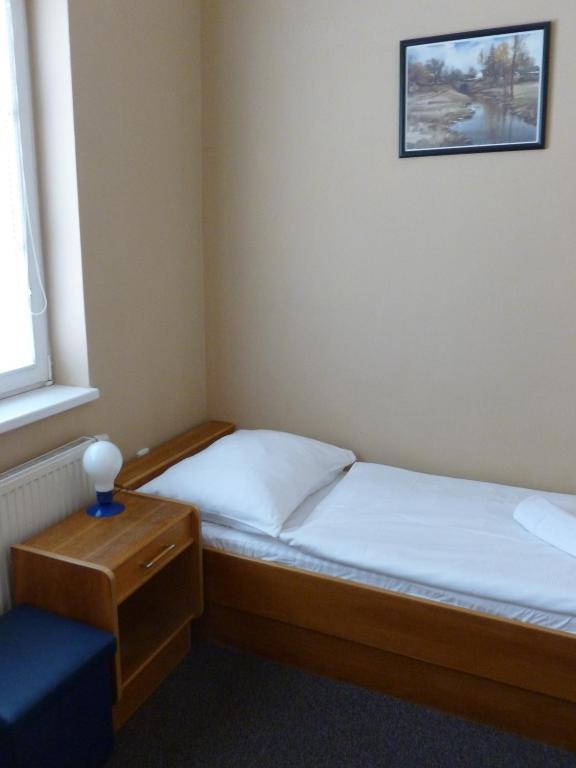 Postel nebo postele na pokoji v ubytování Penzion Šenk Pardubice