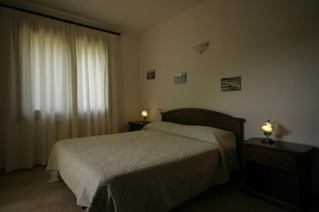 Postel nebo postele na pokoji v ubytování Conca Marina