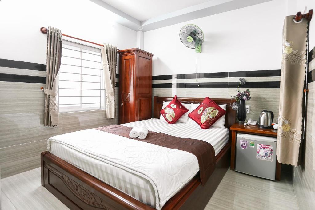 Giường trong phòng chung tại Lucky Hotel Quy Nhon