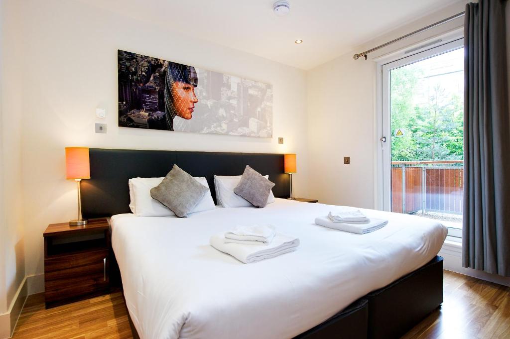a hotel room with a bed and a television at Staycity Aparthotels West End in Edinburgh
