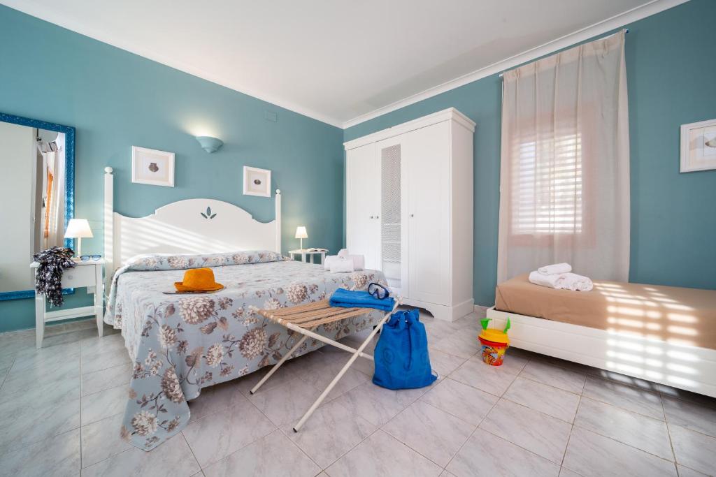Postel nebo postele na pokoji v ubytování TH Gioiosa Mare - Capo Calavà Village