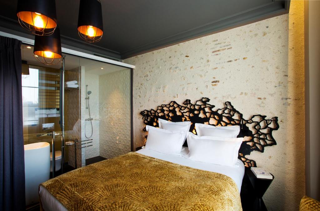Postel nebo postele na pokoji v ubytování Empreinte Hotel & Spa