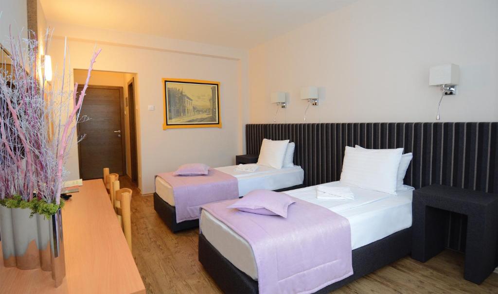Postel nebo postele na pokoji v ubytování Zepter Hotel Drina Bajina Basta, member of Zepter Hotels