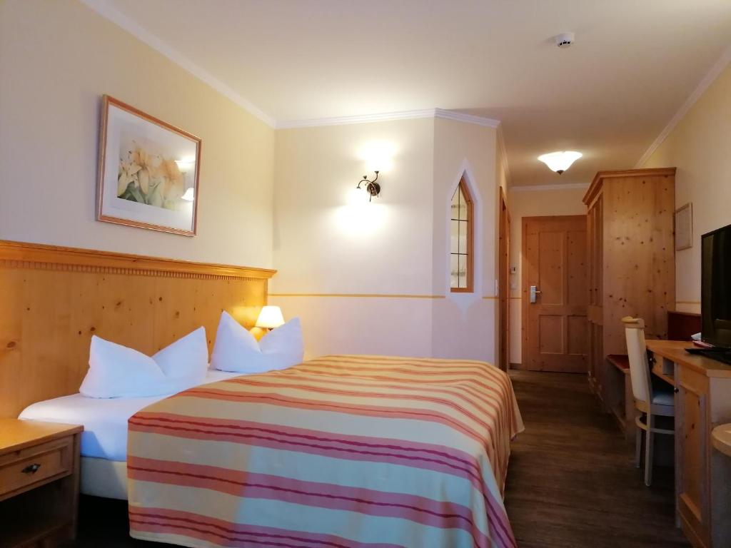 Postel nebo postele na pokoji v ubytování Hotel Sportalm