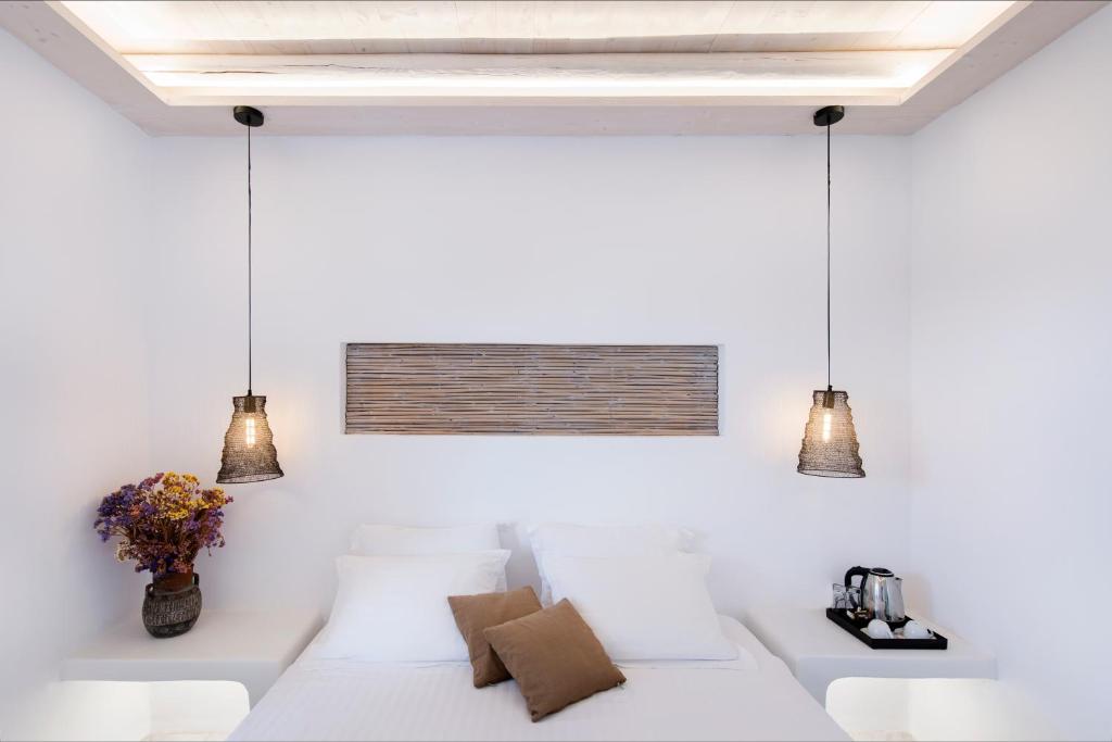 Postel nebo postele na pokoji v ubytování Zefi Hotel & Suites