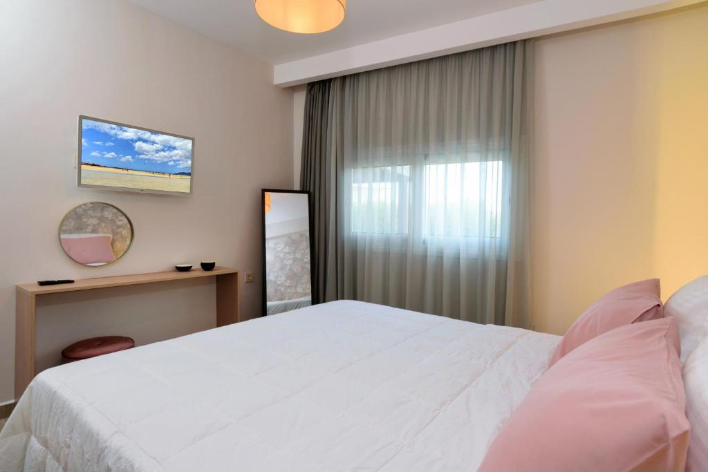 Postel nebo postele na pokoji v ubytování Iliana Apartments