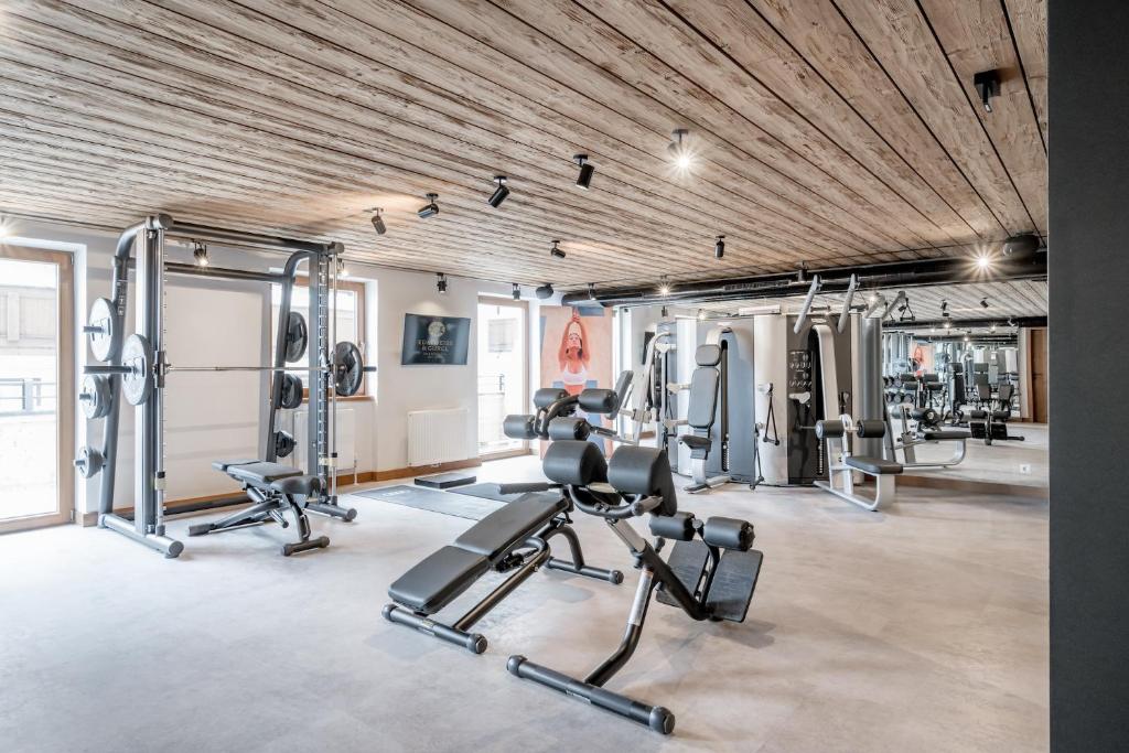 a gym with several treadmills and cardio machines at Hotel Edelweiss & Gurgl in Obergurgl