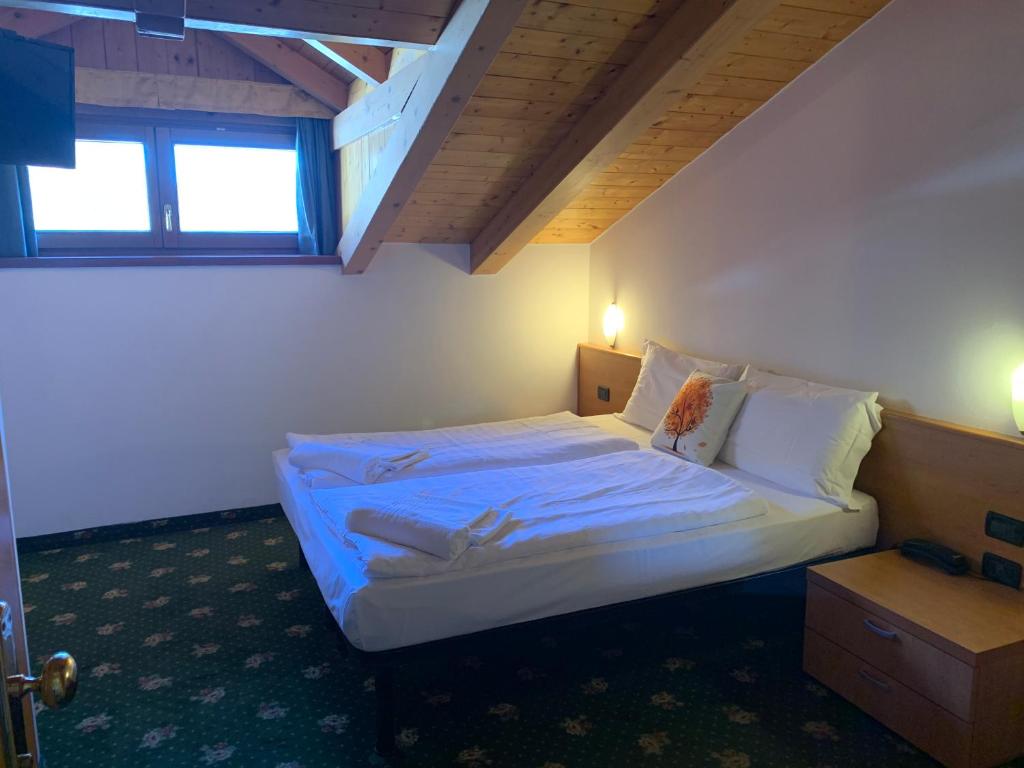 Postel nebo postele na pokoji v ubytování Hotel Pezzotti